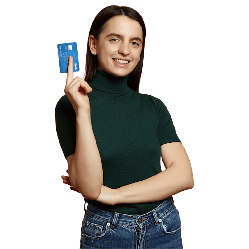 Young woman smiling holding up a credit card