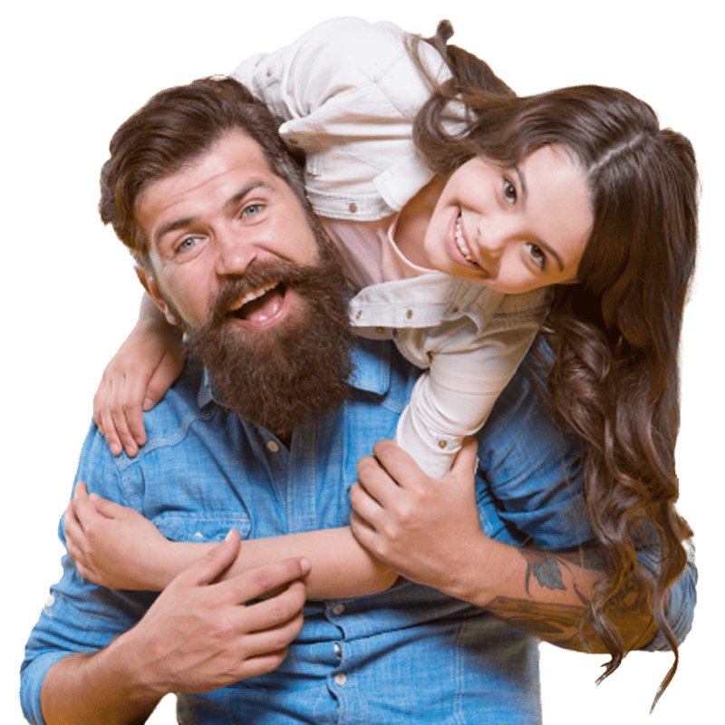 Daughter smiling as she sits on her father's shoulder