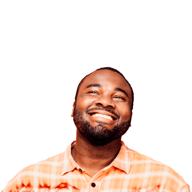 Young man smiling as he looks up into the air