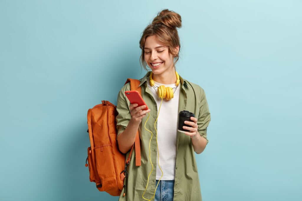 Student reviewing student checking account on her phone