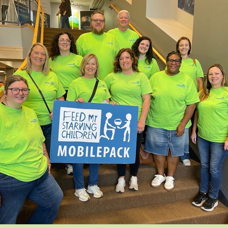 Neighbors Credit Union team participating in Feed My Starving Children community event
