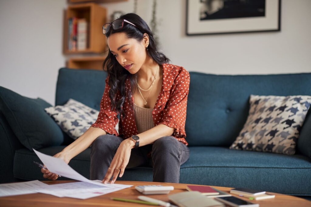 Female homeowner reviewing budgets