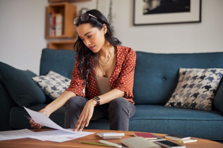 Female homeowner reviewing budgets