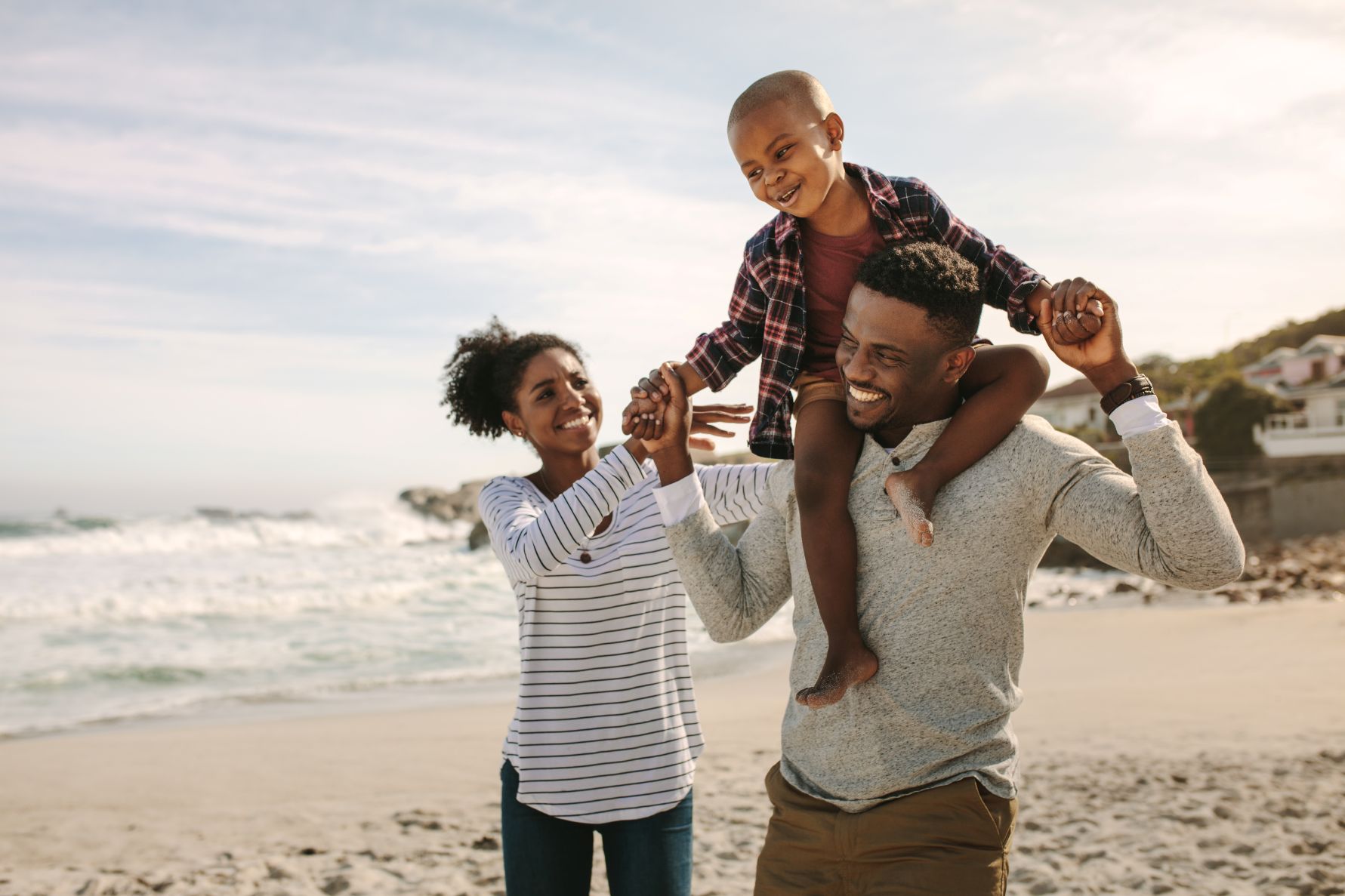 Family at the beach and smiling