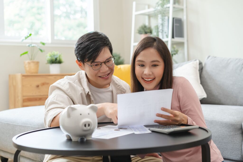 A couple reviewing their bank account details together.
