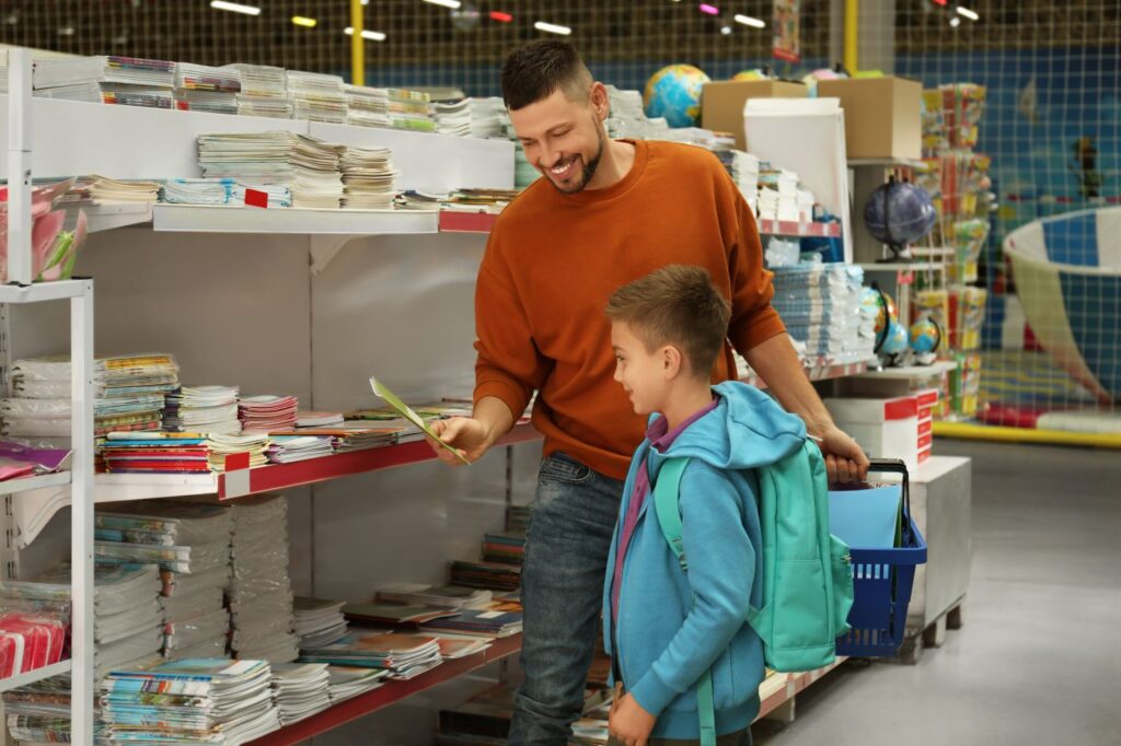 Father and son go shopping for school supplies