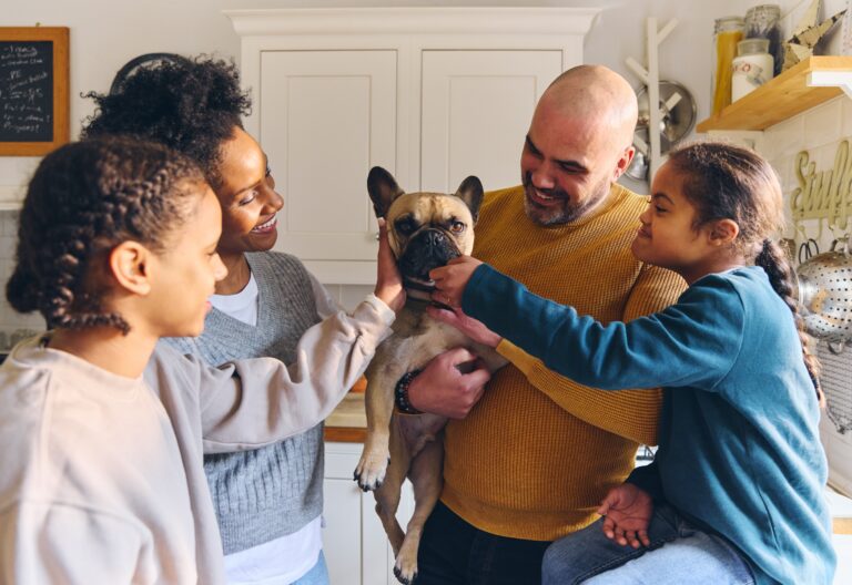 Family,And,Boy,Affected,With,Down,Syndrome,Stroking,Pet,Dog